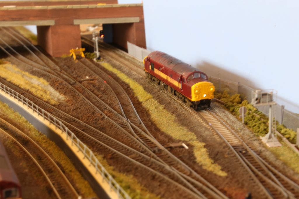 Maroon Class 37 leaving the fiddle yard.