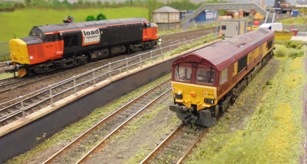 Class 66  and Class 37 passing.